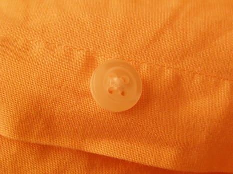 shirt button over orange shirt