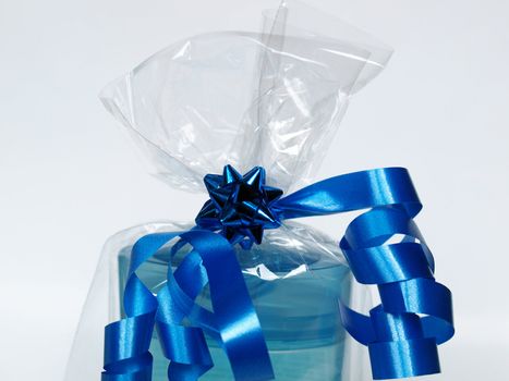 blue ribbon over a present package