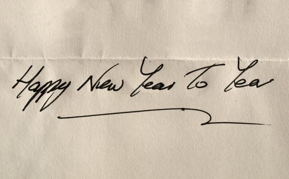 Happy new year to you handwritten in elegant English characters