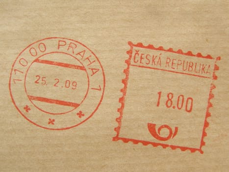 red ink postage meter from Prague stamped on a brown envelope