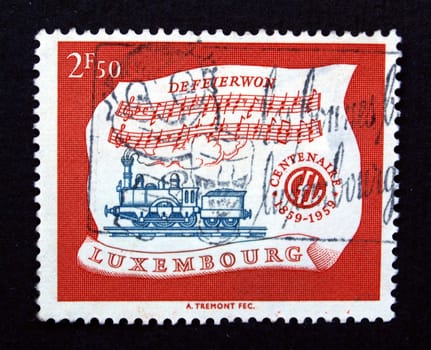 Luxembourg stamp with train over black