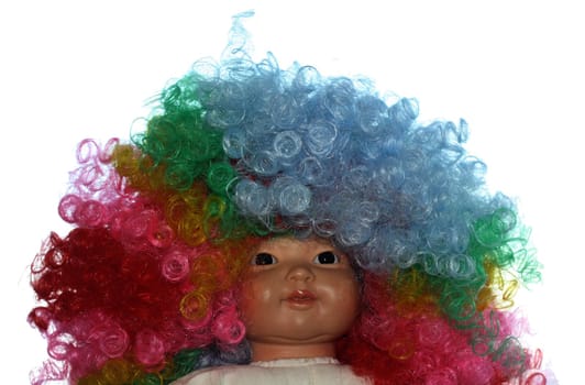 Doll with wig in many colours isolated on a white background