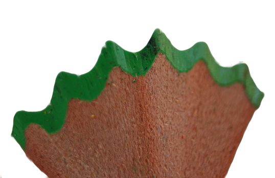 Part of shavings from a green pencil isolated on white background