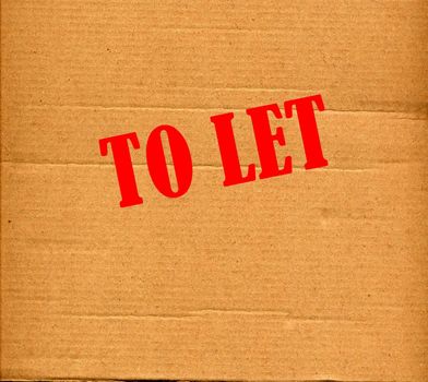 TO LET corrugated cardboard carton background
