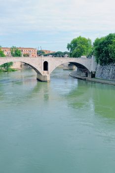 Historic bridge over the Tiber river in Rome. Italy