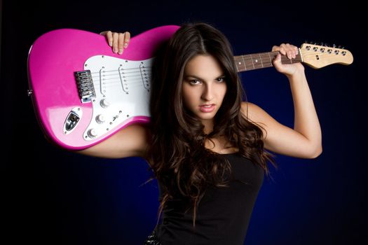 Rock star girl holding guitar