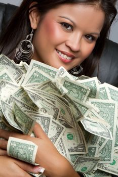 Smiling asian woman holding money