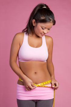Weight loss woman measuring waist