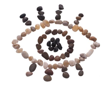 An eye made out of beach pebbles isolated on the white