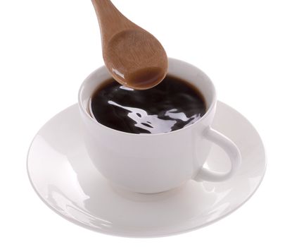 Woman stiring sugar in cup of coffee over white background