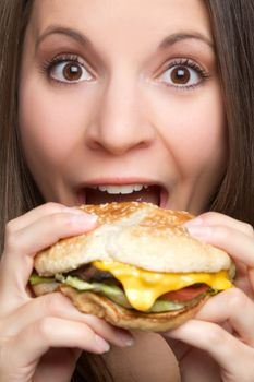 Young woman eating hamburger food