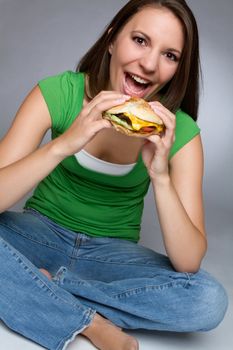 Pretty girl eating burger food