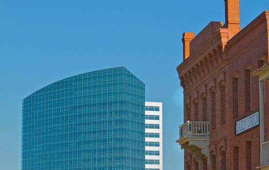 Old brick office buildings with new modern offices in background