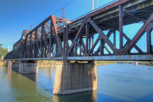 HDR tonemapped image of an old rusty train bridge