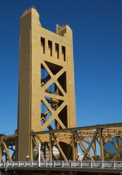 Section of a gold painted tower bridge in Sacramento