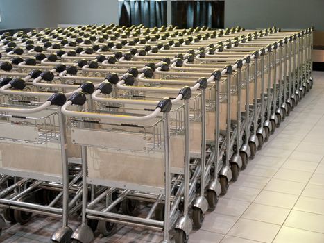 Row of baggage trolleys at an airport