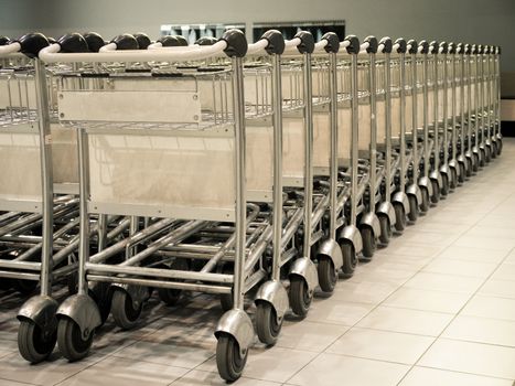 Row of baggage trolleys at an airport