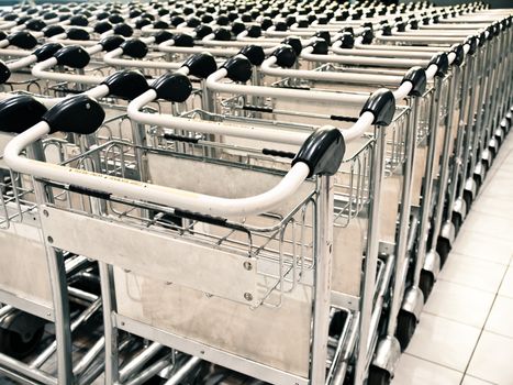 Row of baggage trolleys at an airport