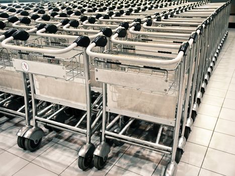 Row of baggage trolleys at an airport