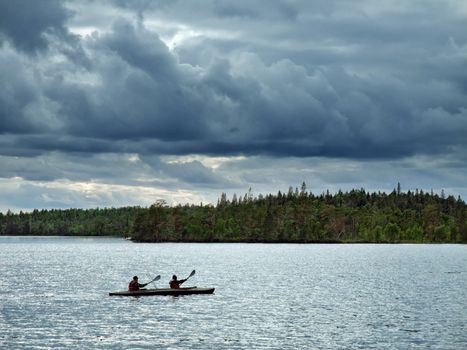 canoe travel on lake at light northern night