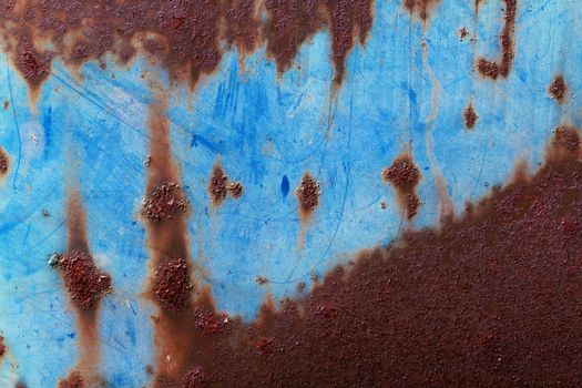 Grunge background of rusted blue metal.