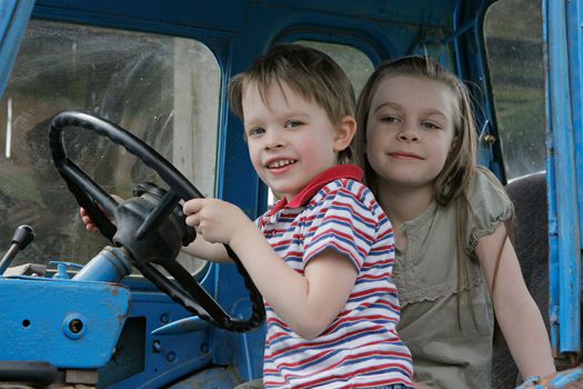 Brother and sister first time in tractor cab.