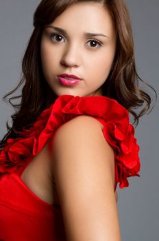 Pretty young hispanic girl wearing red