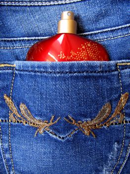 Perfume Bottle in the back pocket of blue jeans.                    