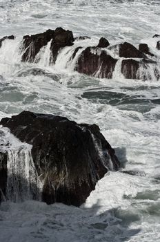 Foaming waves at the seashore of Madeira island.