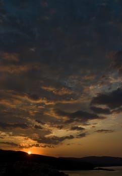 Sunrise and colorful clouds in Limenaria on Thasos Island, Greece.