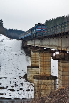 Passenger train passing through the  bridge