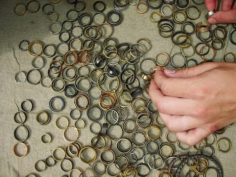 On a canvas metal rings of different colors lay