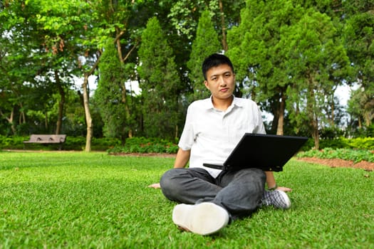 man using computer outdoor