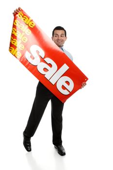 A man about to hang up a large Sale banner sign.  Suitable for many uses, retail, Christmas,clearance, etc.  Focus to the sign.