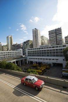 taxi passing the road in city at day