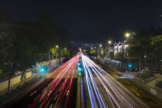 traffic in city at night with long car light
