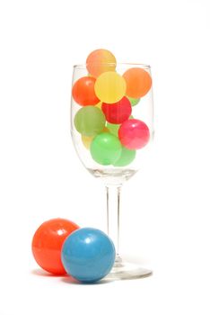 A colorful drink made from rubber balls for an abstract concept.