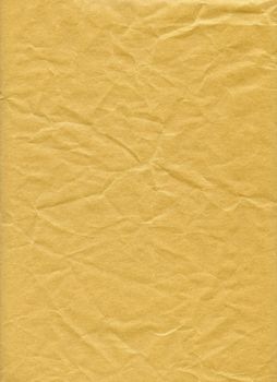 An isolated old grunge yellow paper folded