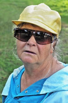 portrait elderly women in brown glasses