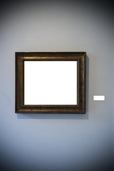 An aged frame on a white wall