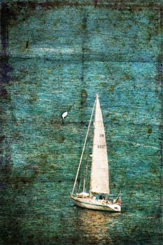 A grunge image of a boat in the sea