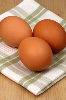 raw eggs on fancy kitchen napkin, one of the most used food ingredient