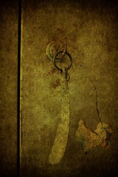 A grunge door closed with the key