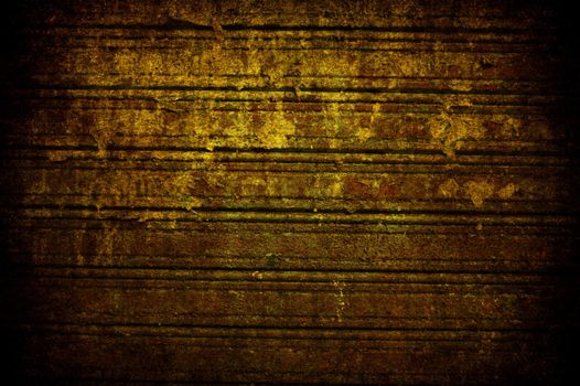 A grunge old rusted yellow metal shutter