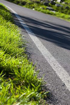 Close up of a road in the green