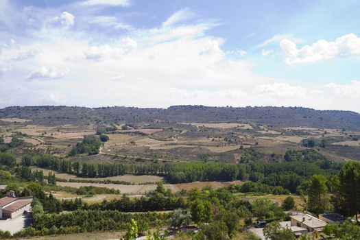 View along the river Tajo, with fields. Brihuega, Spain