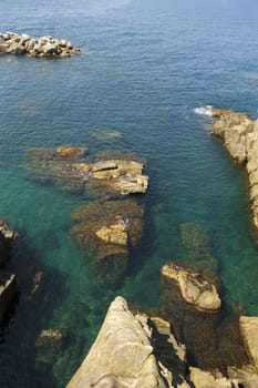 Many rock inside the sea in a bay