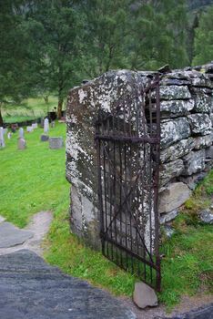 Aged iron gate of old cemetery