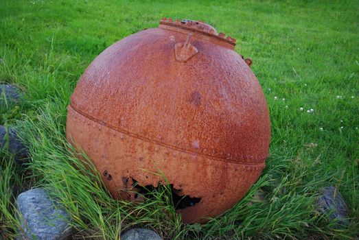 Old rusty marine mine on the nothern norway coast