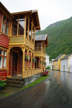 Traditional wooden houses on hillside background in Lyrdal, Norway